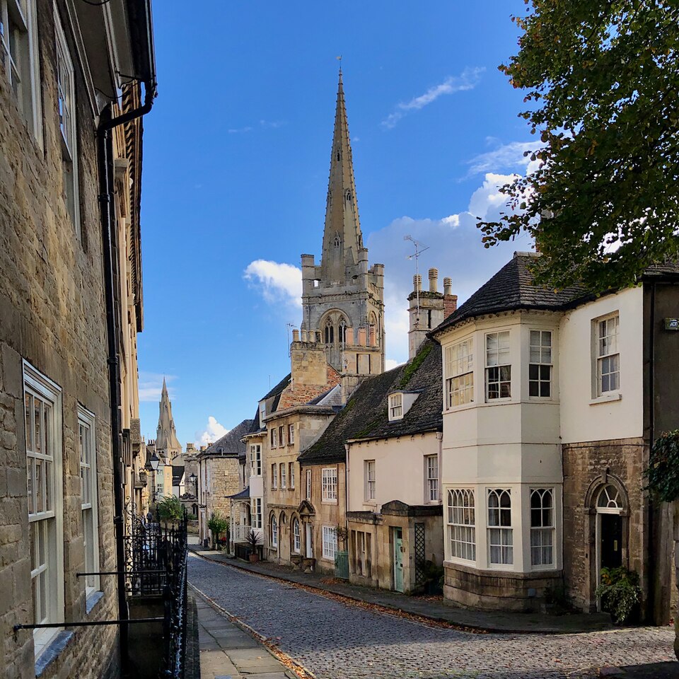 Cobbled Barn Hill in Stamford looking towards the spire of All Saints' Church