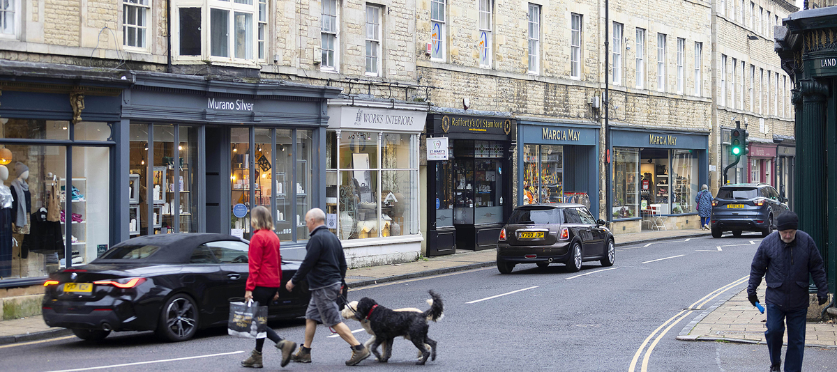 Shops and historic stone buildings along Stamford's High Street
